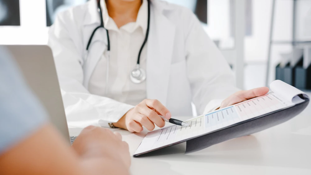 Close-up of doctor discussing immigration medical exam results in Houston