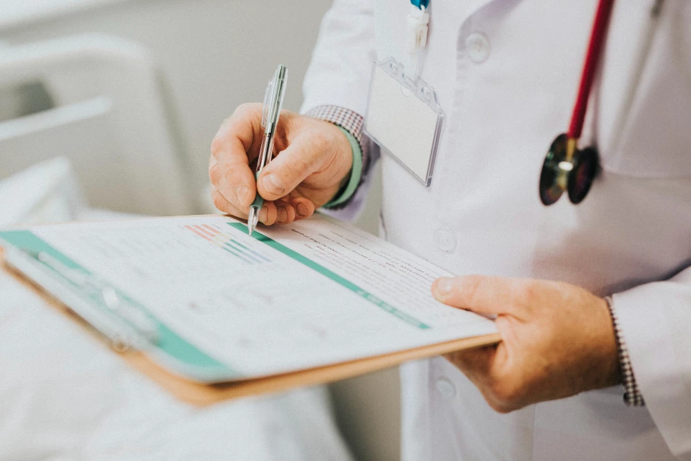 Close-up of medical form review for immigration exam in Houston facilit