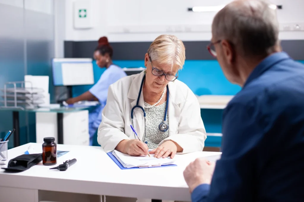 Skilled female doctor recording notes with male patient in bustling clinic, ensuring accuracy for USCIS immigration medical physical process.