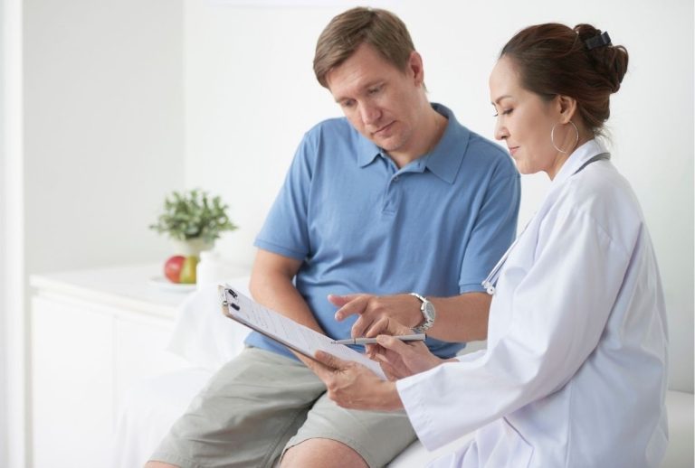 Doctor discussing lab results with patient during immigration medical exam same day appointment at Houston medical office