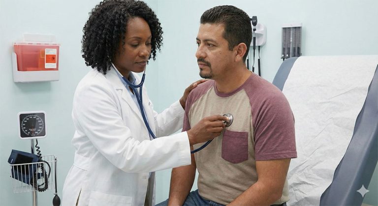 Female physician using stethoscope to examine patient chest at cheapest immigration medical exam Houston clinic, thorough USCIS-approved health check.