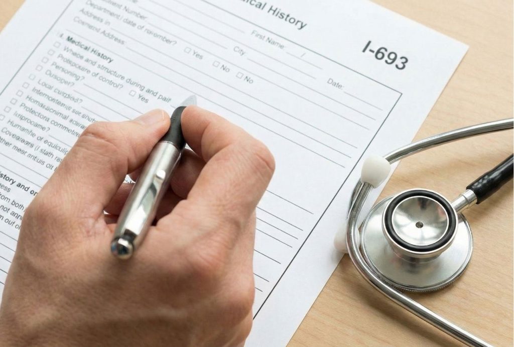 Close-up of a hand filling out the I-693 medical history form. This paperwork is a key part of the process when seeking a cheapest immigration medical exam.